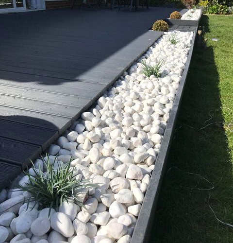 Cobbles used for edging around decking