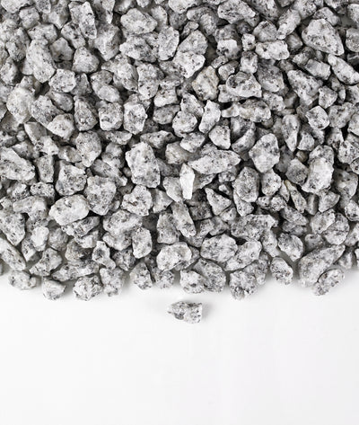 A close-up image of Silver Blue Granite Gravel chippings against a white background.