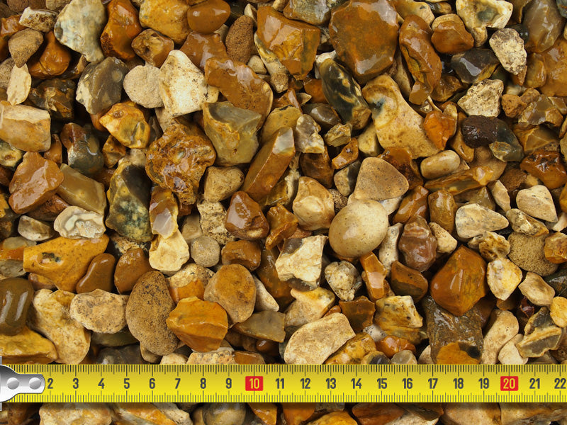 Measuring tape demonstrating the size range of the gravel