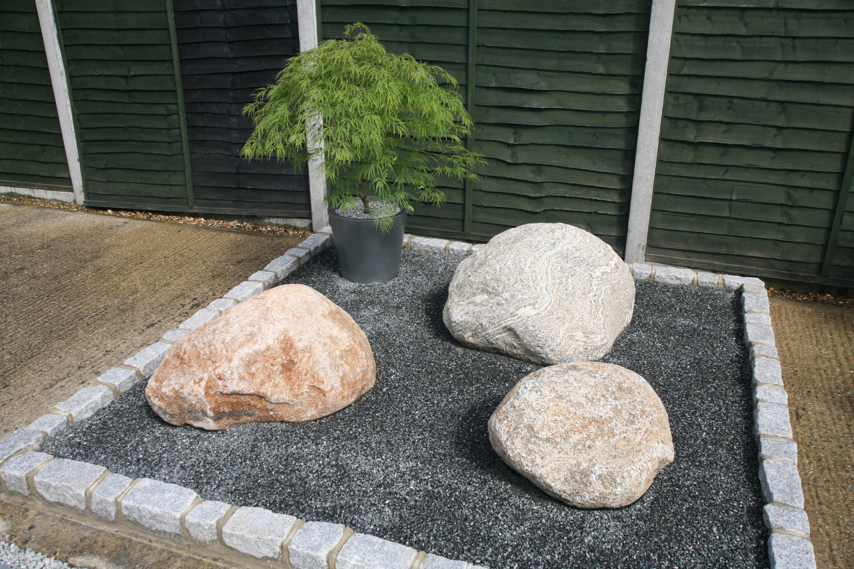 Product being used in a garden rockery