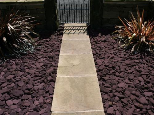 plum paddlestones laid either side of a front garden path 