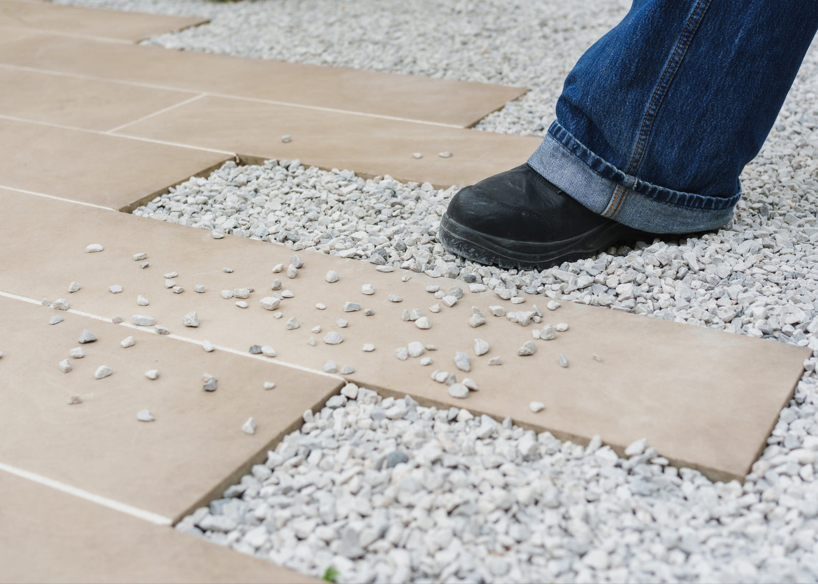 Pathway with loose gravel before Gravel Grip application