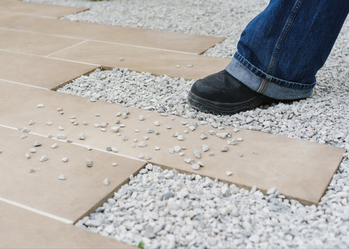 Pathway with loose gravel before Gravel Grip application