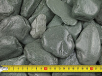 Measuring tape demonstrating the size of the paddlestones