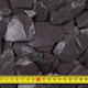 Close up with tape measure of blue slate chips