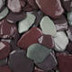 close up image of snowdonia tumbled slate pieces 40mm