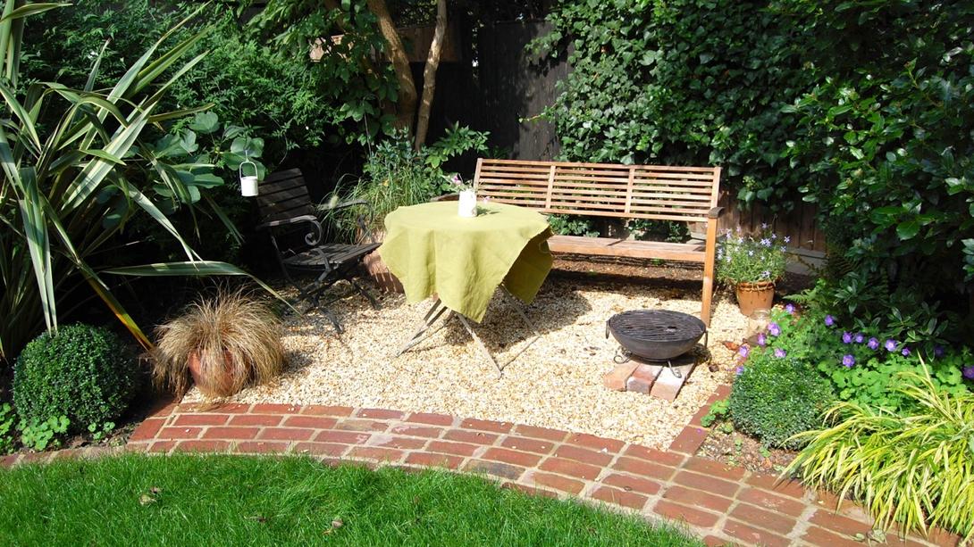 garden transformation and cotswold gravel ground covering, garden bench and table 