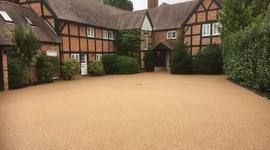 Large resin bound driveway that is golden in colour 