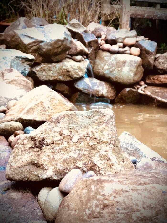 Welsh Quartz Granite Boulders placed at the side of pond 