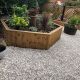 Gravel next to timber planters