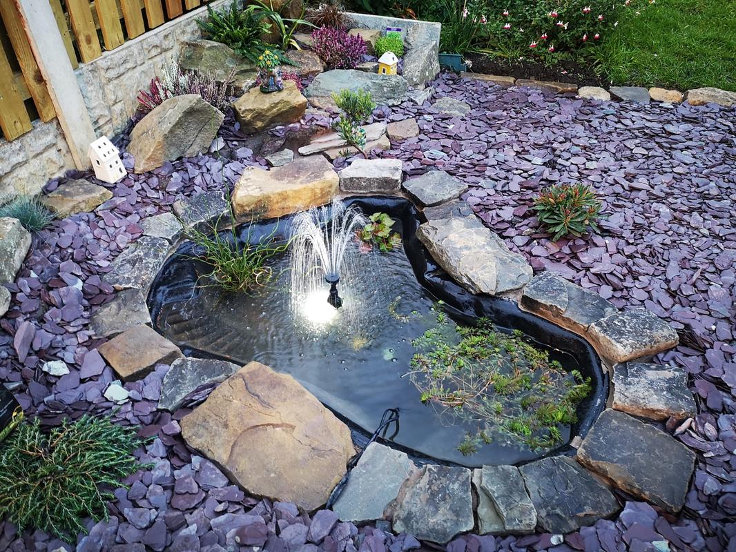 Slate chippings surrounding a pond