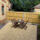 Gold gravel garden with table and chairs
