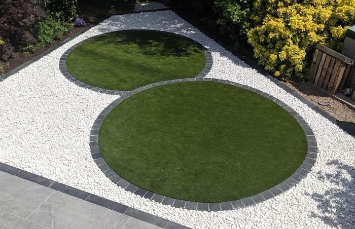 Polar white pebbles in circle garden feature