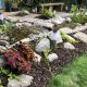 welsh quartz granite boulders placed in garden planting area