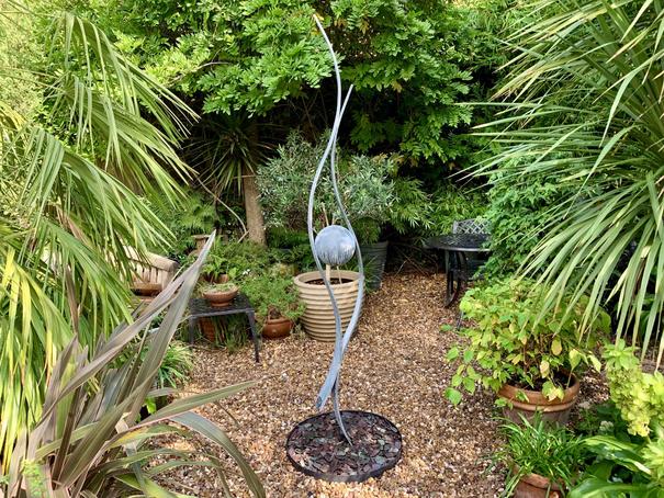 Pea Gravel Garden With Attractive Metal Ornament