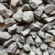 a close up image of charcoal granite gravel when first delivered, showcasing a natural dust on the stones.