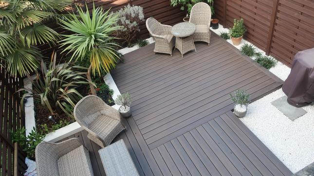 Polar white gravel used to fill space and be a decorative feature around other garden features such as brown decking
