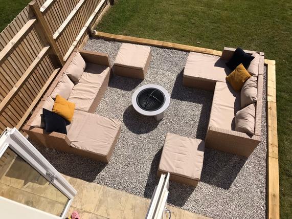 garden furniture with dove grey gravel laid underneath to highlight brown sofas and chairs