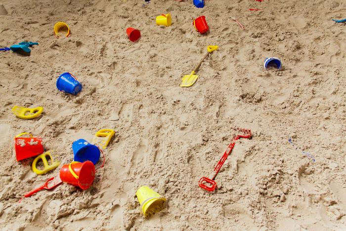 Children's play pit sand with buckets and spades 