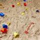 Children's play pit sand with buckets and spades 