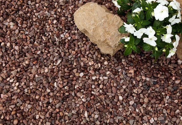 horticultrual grit laid in garden next to rock and flowers