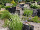 Lovely garden rockery featuring large rockery stones and colourful plants and flowers