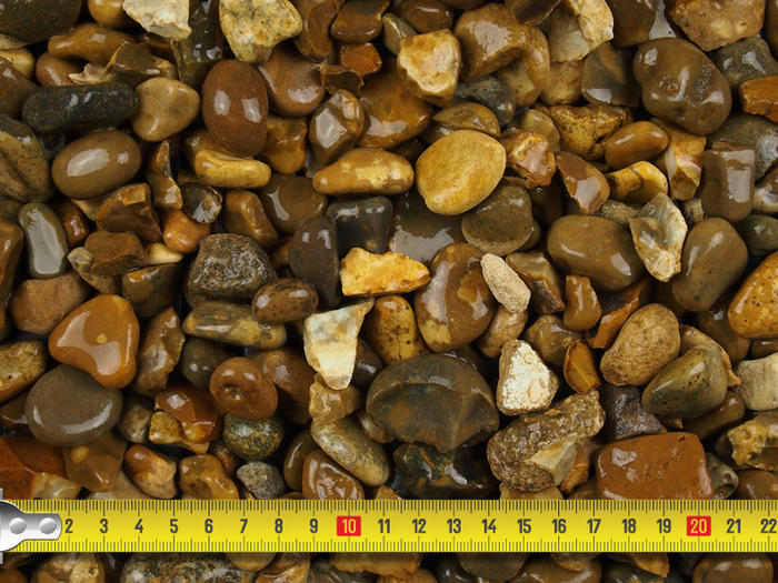 image showcasing size of lomond gravel with tape measure 