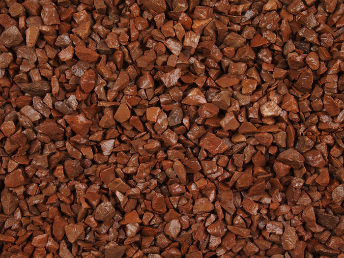 Red granite Gravel chippings close up image