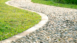Cobbles used and set in cement for bending pathway
