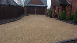 Driveway with garages and gravel finish