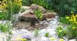 Garden boulders and rockery placed in a water feature and stream 