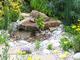 Garden boulders and rockery placed in a water feature and stream 